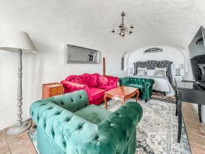 a living room with a couch and a bed at Brilliant apartment in Château du Châtelard in Montreux