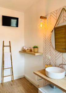 a bathroom with a sink and a mirror at La Bartola Guesthouse in Ibiza Town