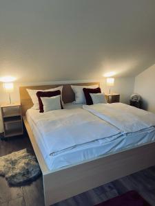 En eller flere senge i et værelse på gemütliche Wohnung alpenländisch