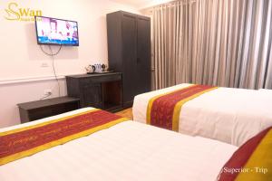 Postel nebo postele na pokoji v ubytování Swan Sapa Hotel