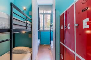 a room with two bunk beds and a hallway at Hostel Center Madrid in Madrid