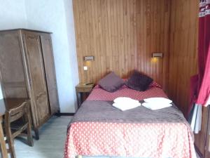 Postel nebo postele na pokoji v ubytování Hôtel Le Mont Jorat