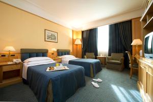 TV a/nebo společenská místnost v ubytování Grand Hotel Barone Di Sassj