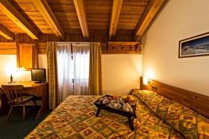 Postel nebo postele na pokoji v ubytování Hotel Beau Site