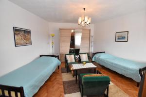 En eller flere senge i et værelse på Holiday Home Katarina + 14 billeder