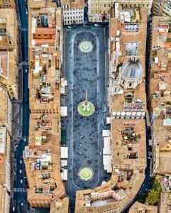 an aerial view of a city with a clock tower at Rome s Suite Bramante in Rome