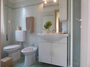 a bathroom with a sink and a toilet at Residence Valeria in Cervia