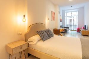 Posteľ alebo postele v izbe v ubytovaní Urbe10 Plaza de la Constucion Premium Loft