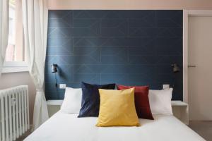 A bed or beds in a room at bilocale Aleardi