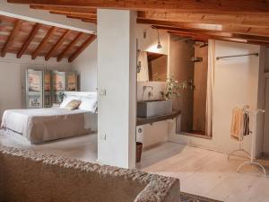 a bedroom with a bed and a sink at Masseria Scannaturco in Marina di Pisticci