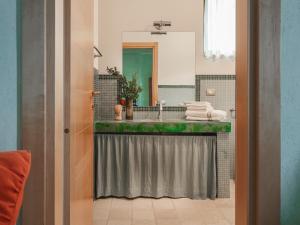 a bathroom with a sink and a mirror at Masseria Scannaturco in Marina di Pisticci +56 photos