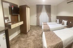 Postel nebo postele na pokoji v ubytování فندق سمى الخير