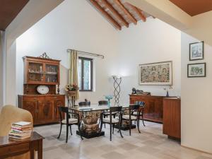 a dining room with a table and chairs at Masseria Scannaturco in Marina di Pisticci