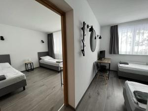 a room with two beds and a mirror at Petrico Camp Resort in Krzywopłoty