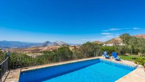 a swimming pool with a view of the mountains at Los Olivos Antequera - Los Nogales by Ruralidays in Antequera
