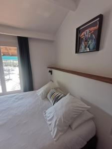 Postel nebo postele na pokoji v ubytování L'auberge Camarguaise