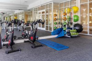 a gym with several treadmills and exercise bikes at Santa Clara 1BR w Gym Pool WD SFO-641 in Santa Clara