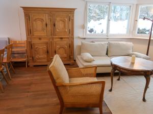 a living room with a couch and a table at Holiday Home Kesslerberg by Interhome in Hinterzarten