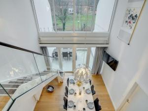 a living room with a table and a large window at Apartment Pekka - 50m from the sea in Sealand by Interhome in Helsingør