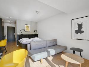 a living room with a couch and a bed at Apartment Liv - 50m from the sea in Sealand by Interhome in Helsingør