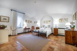 Postel nebo postele na pokoji v ubytování Palazzo Belmonte