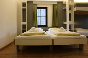 Säng eller sängar i ett rum på Jugendherberge Dinkelsbühl - Youth Hostel