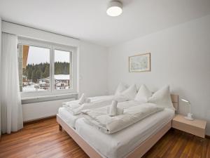 Postel nebo postele na pokoji v ubytování Apartment Nr-14 Haus Astoria by Interhome