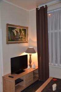 TV a/nebo společenská místnost v ubytování Apartment Sariks Place
