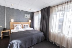 Postel nebo postele na pokoji v ubytování Hotel De Boei