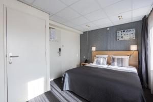 Postel nebo postele na pokoji v ubytování Hotel De Boei