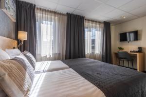 Postel nebo postele na pokoji v ubytování Hotel De Boei