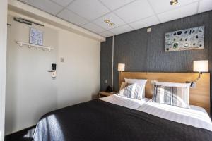 Postel nebo postele na pokoji v ubytování Hotel De Boei