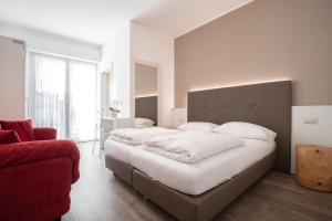 Letto o letti in una camera di Hotel Rolly
