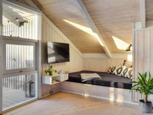 A bed or beds in a room at Holiday Home Nilsa - 400m from the sea in Funen by Interhome