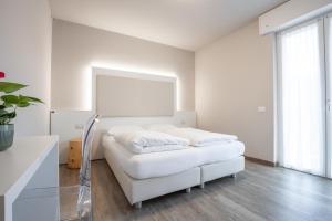 Letto o letti in una camera di Hotel Rolly