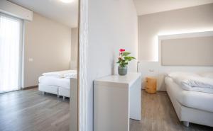 Letto o letti in una camera di Hotel Rolly