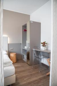 Letto o letti in una camera di Hotel Rolly