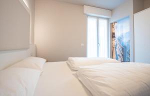 Letto o letti in una camera di Hotel Rolly