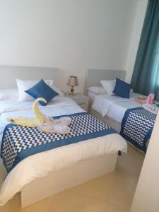 A bed or beds in a room at Sharm Hills