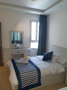 A bed or beds in a room at Sharm Hills