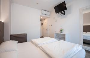 Letto o letti in una camera di Hotel Rolly