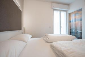 Letto o letti in una camera di Hotel Rolly
