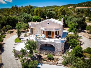 an aerial view of a villa with a swimming pool at DN Beach Coast Villa in Skinária