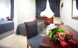 Voodi või voodid majutusasutuse Hotel Leonardo toas