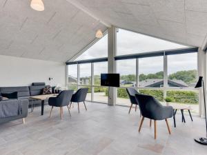 a living room with a couch and chairs at Holiday Home Helina - 180m from the sea in SE Jutland by Interhome in Haderslev