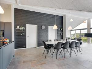 a kitchen and dining room with a table and chairs at Holiday Home Helina - 180m from the sea in SE Jutland by Interhome in Haderslev