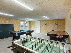 two ping pong tables in a room with at Holiday Home Helina - 180m from the sea in SE Jutland by Interhome in Haderslev
