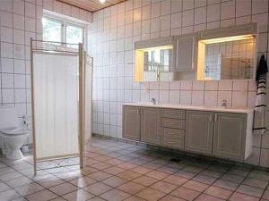 a bathroom with a shower and a sink and a toilet at Apartment Thia - 4km to the inlet in SE Jutland by Interhome in Aabenraa
