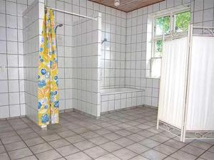 a bathroom with a shower and a shower curtain at Apartment Thia - 4km to the inlet in SE Jutland by Interhome in Aabenraa