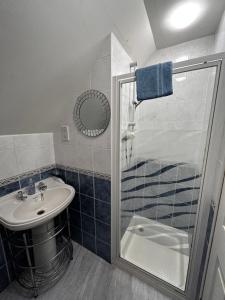 a bathroom with a shower and a sink at Acer Lodge Guest House in Edinburgh